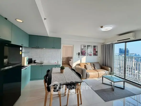 Modern open-layout living room with kitchen, dining area, and city view balcony.