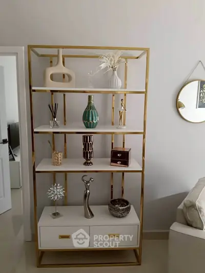 Stylish living room with elegant shelving unit and modern decor accents.