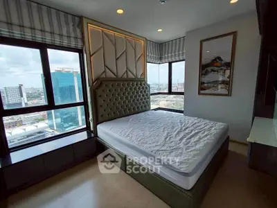 Luxurious bedroom with panoramic city view and elegant decor