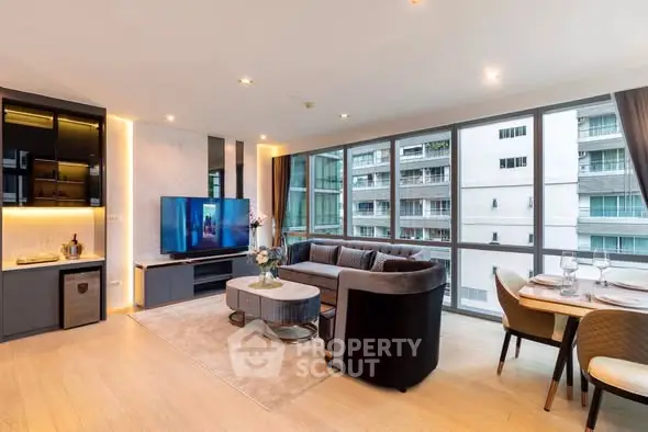 Spacious modern living room with large windows and elegant dining area in luxury apartment.