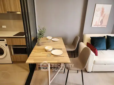 Modern apartment interior with compact dining area and cozy living space
