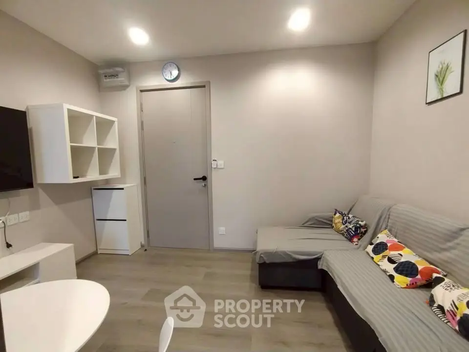 Cozy modern living room with stylish decor and comfortable seating in a contemporary apartment.
