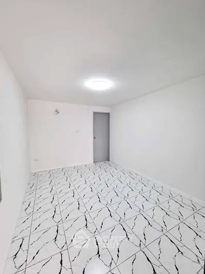 Minimalist white room with modern tiled flooring