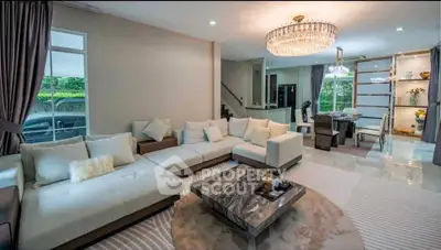 Luxurious living room with elegant chandelier and spacious seating area