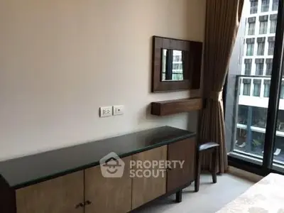 Modern bedroom with stylish furniture and large window view