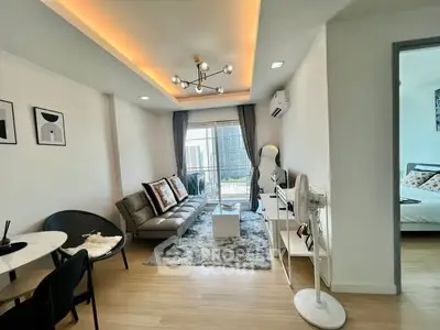 Modern living room with stylish decor and city view balcony