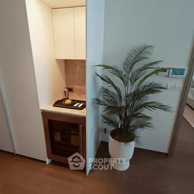 Modern apartment with stylish kitchenette and elegant decor