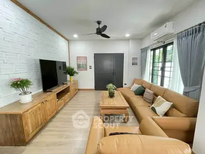 Spacious living room with modern decor and large TV unit