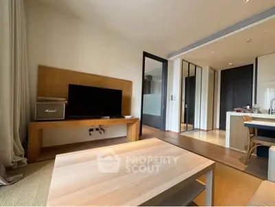 Modern living room with wooden furniture and open kitchen layout