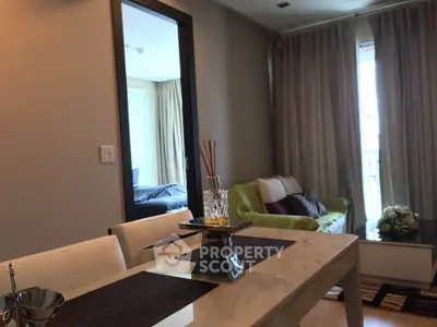 Modern living room with elegant dining area and cozy seating, perfect for relaxation and entertaining.