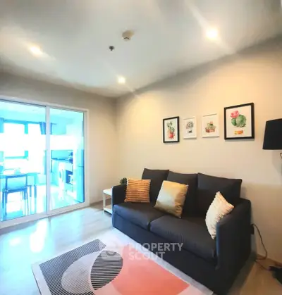 Modern living room with cozy sofa and stylish decor in a bright apartment.