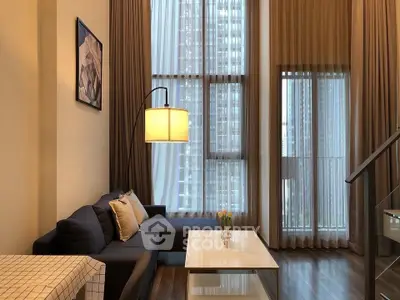 Luxurious modern living room with high ceilings and elegant decor in a city apartment.