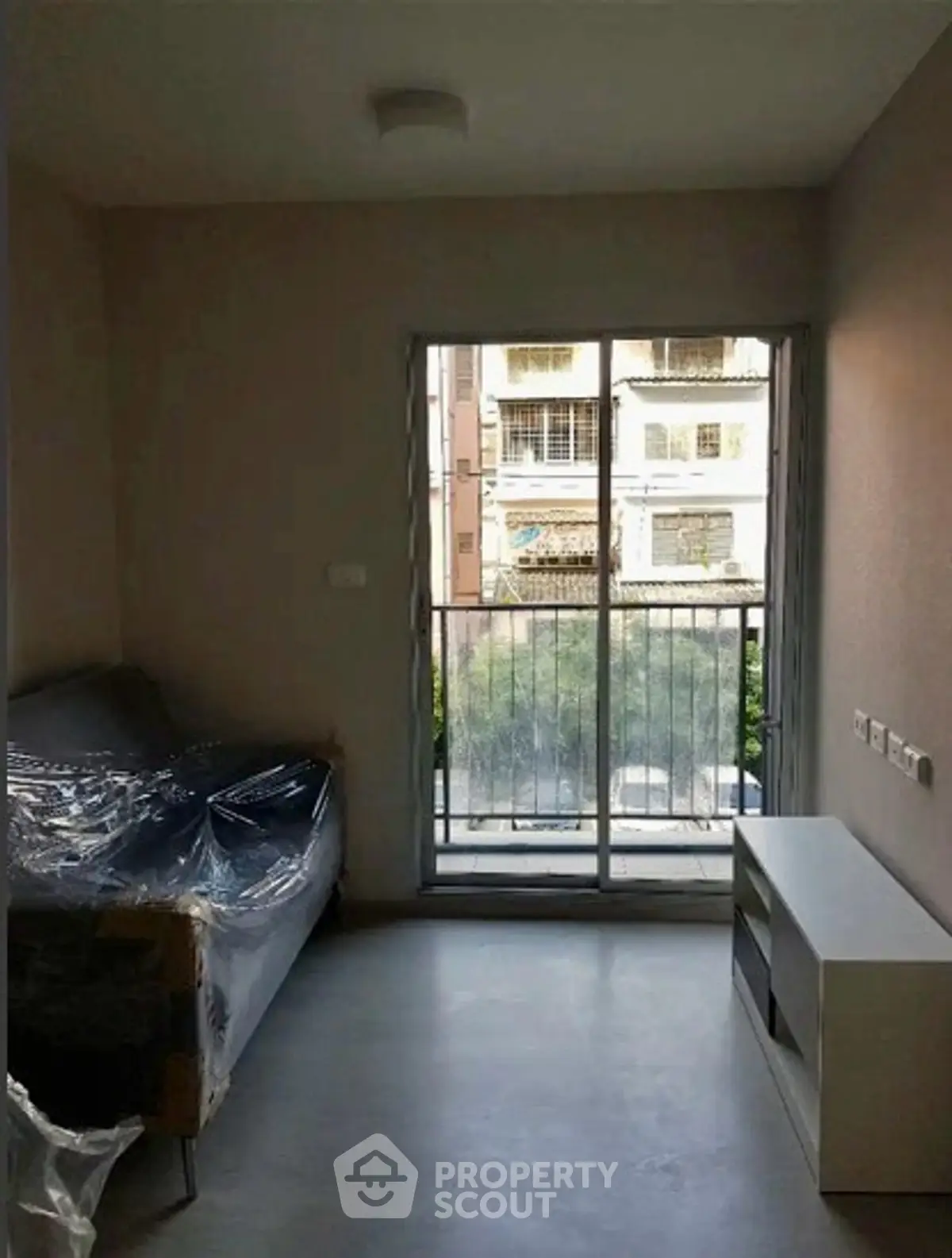 Cozy living room with balcony view in modern apartment