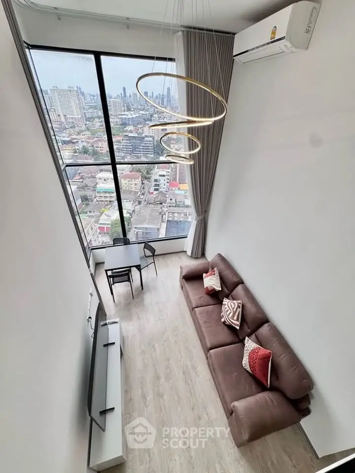 Stunning high-rise living room with floor-to-ceiling windows and city view