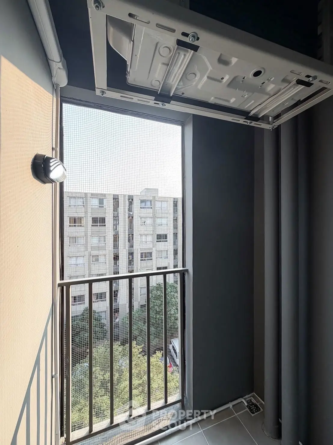 Modern apartment window with a view of urban architecture