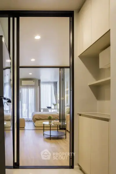 Modern studio apartment with sliding glass doors and stylish interior design
