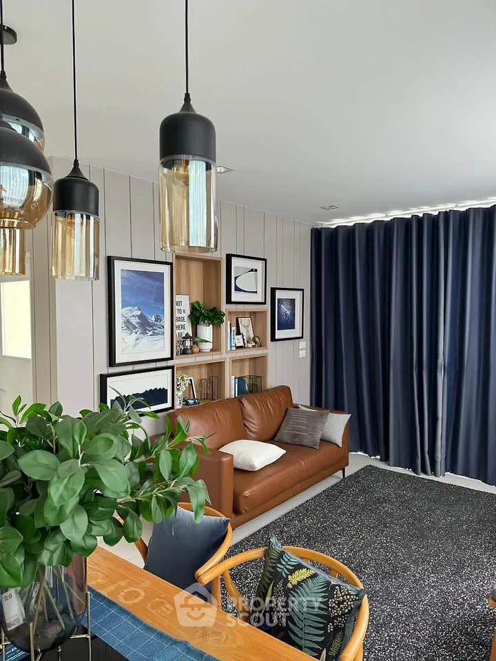 Stylish living room with modern decor, leather sofa, and elegant lighting