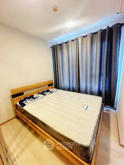 Modern bedroom with cozy wooden bed and blackout curtains for ultimate comfort.
