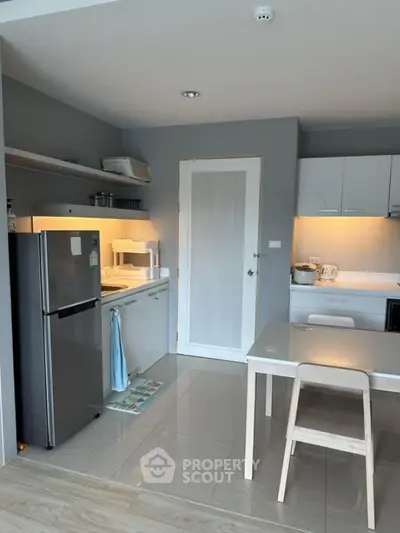 Modern kitchen with sleek appliances and minimalist design