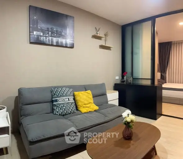 Modern living room with stylish decor and cozy ambiance in a contemporary apartment.