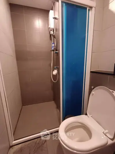 Modern bathroom with shower and toilet in sleek design