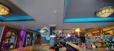 Luxurious bar interior with vibrant lighting and elegant decor