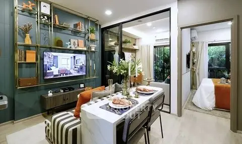Modern open-plan living room with stylish decor and dining area, perfect for contemporary living.