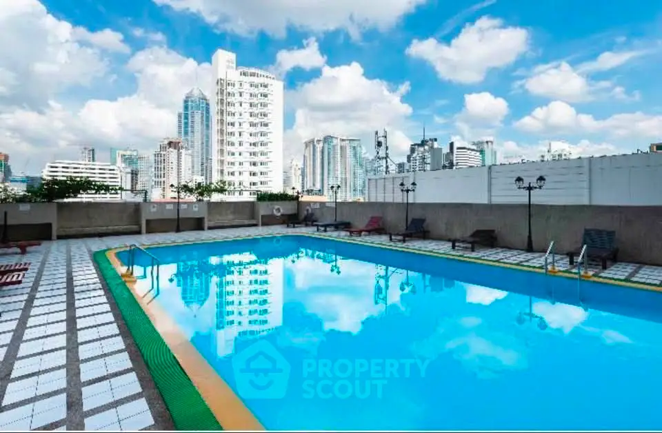 Stunning rooftop pool with city skyline views, perfect for relaxation and leisure in urban setting.