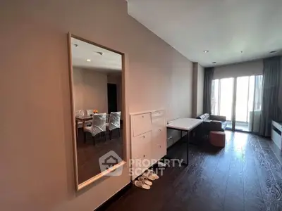 Spacious modern living room with elegant dining area and large windows for natural light.