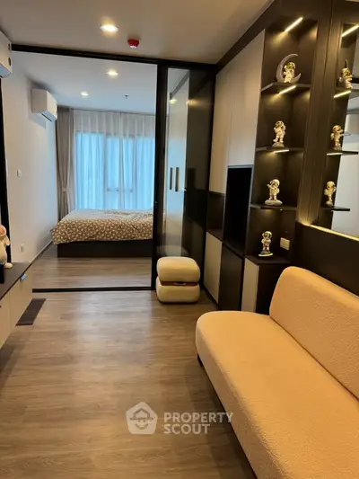 Modern apartment interior with cozy living room and elegant bedroom view