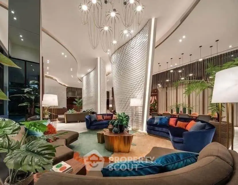 Luxurious modern living room with elegant lighting and plush seating in a stylish open layout.