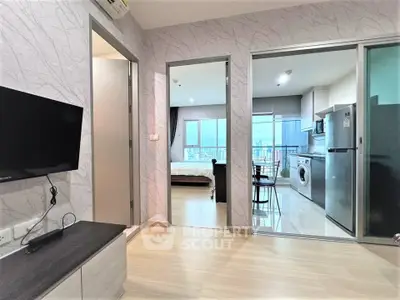 Modern apartment interior with open layout, featuring a living room, kitchen, and bedroom with city view.