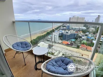 Stunning balcony view overlooking the ocean and city skyline, perfect for relaxation.