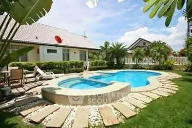 Luxurious villa with private pool and lush garden, perfect for relaxation and entertainment.