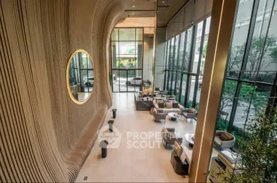 Luxurious modern lobby with high ceilings and elegant seating area