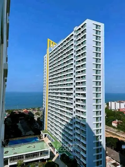 Stunning high-rise building with ocean view, perfect for luxury living.