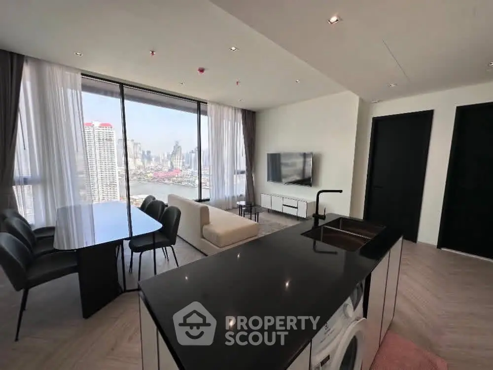 Luxurious modern living room with stunning city view and sleek kitchen island.