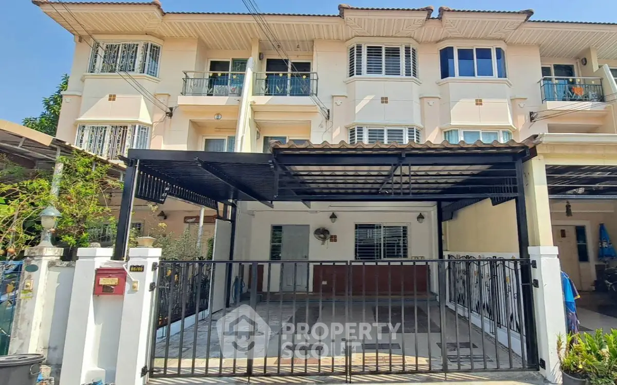 Charming townhouse with gated parking and balcony in a serene neighborhood