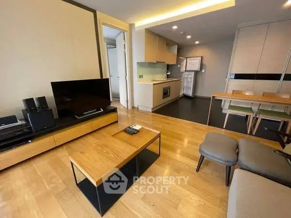 Modern living room with open kitchen and stylish furniture