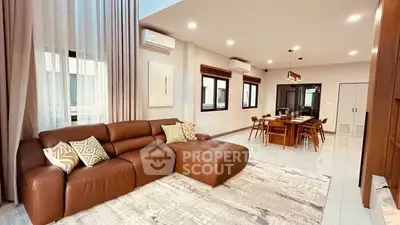 Spacious modern living room with elegant dining area and stylish decor.