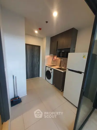 Modern compact kitchen with appliances in a stylish apartment