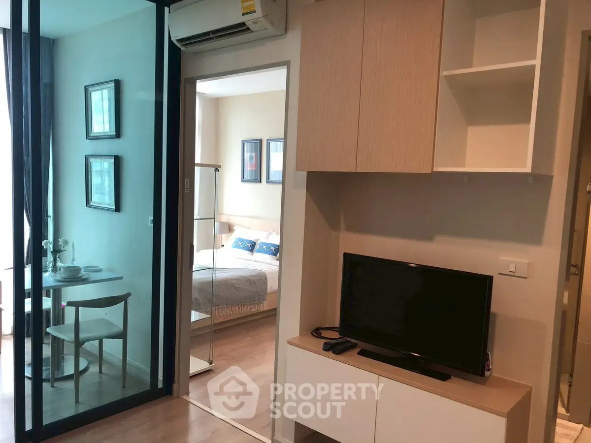 Modern apartment interior with cozy living room and bedroom, featuring stylish furniture and decor.