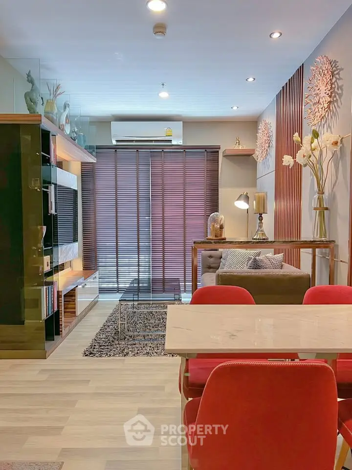 Stylish modern living room with elegant decor and vibrant red chairs