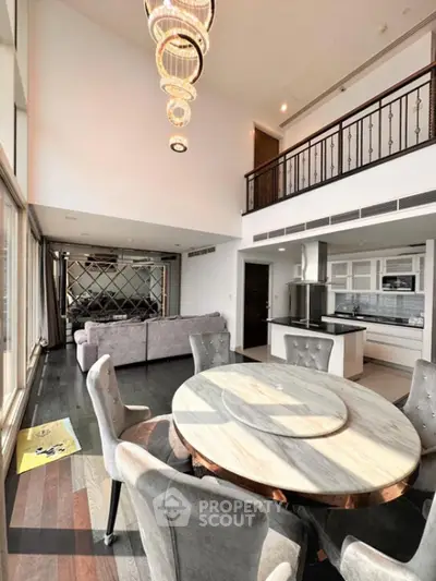 Luxurious open-plan living room with modern kitchen and elegant dining area