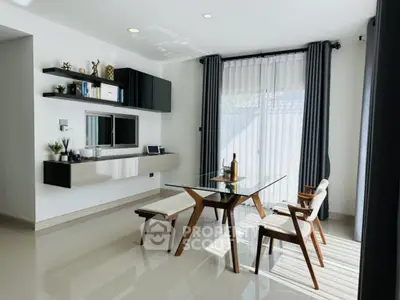 Modern dining area with glass table and stylish chairs in bright room