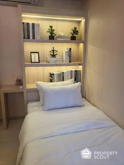 Cozy bedroom with built-in bookshelf and modern decor