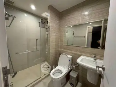 Modern bathroom with glass shower and sleek fixtures