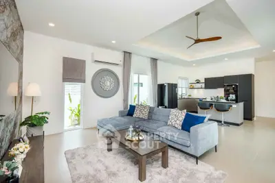 Spacious modern living room with open kitchen and stylish decor