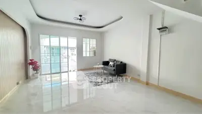 Spacious modern living room with elegant decor and natural light