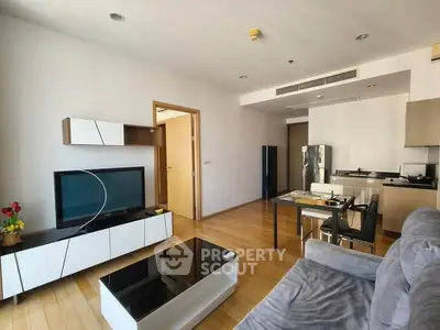 Modern living room with open kitchen and stylish furniture